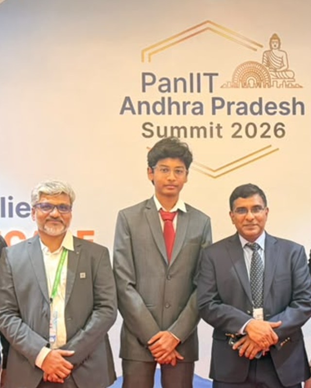 Tata Maithrinath with CV Sreedhar, Director of the AP State Quantum Mission, on the right and another attendee on the left, in front of the PanIIT Andhra Pradesh Summit 2026 backdrop.