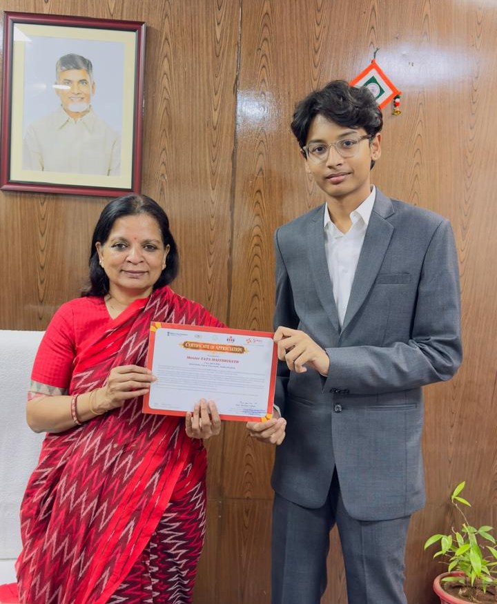 Tata Maithrinath receiving the Certificate of Appreciation from Smt. Karuna Vakati, Chief Executive Officer of SERP, in an office.