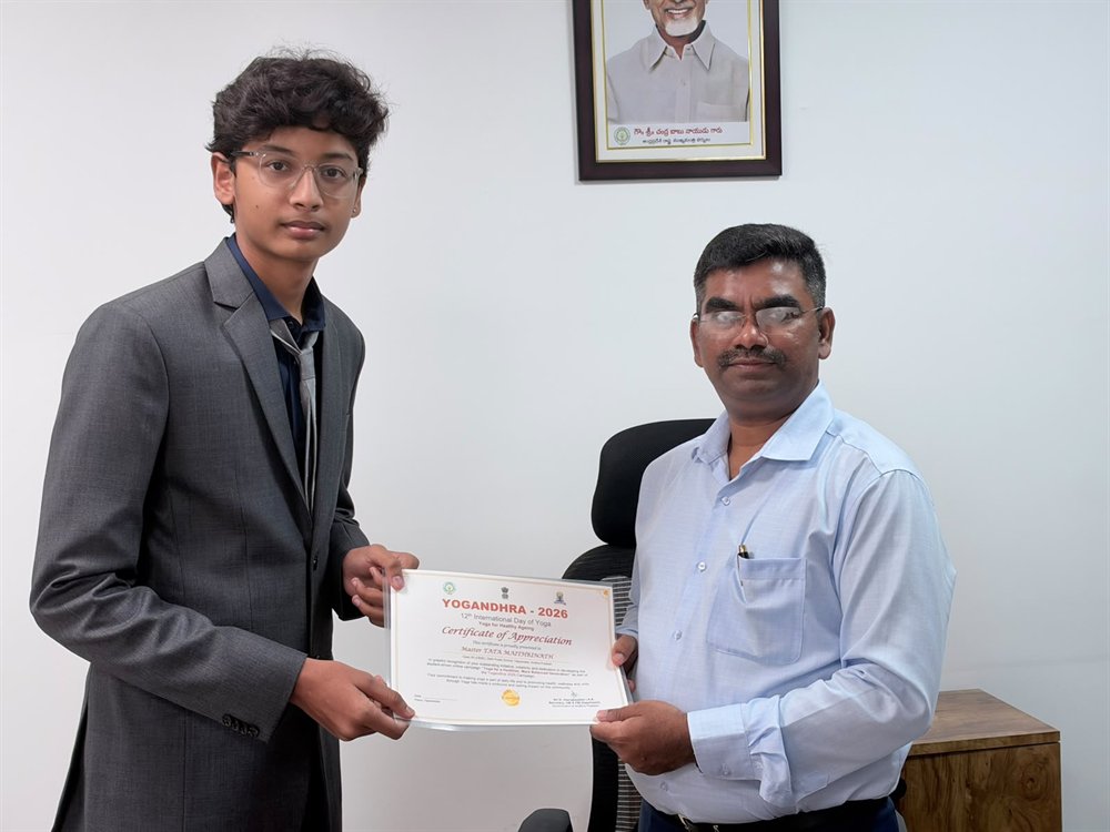 Tata Maithrinath receiving the Yogandhra 2026 Certificate of Appreciation from Sri G. Veerapandian, I.A.S., in an office.